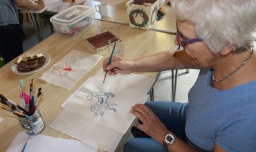A care worker supporting a younger adult