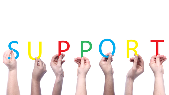 Hands holding letters that spell support